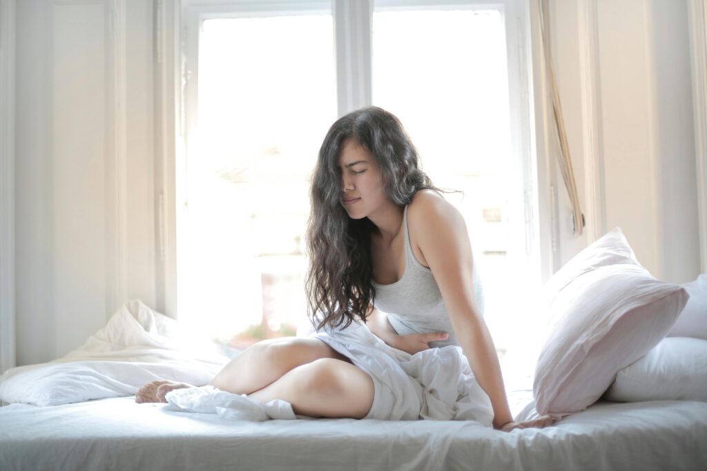 woman with nausea, stomach pain
