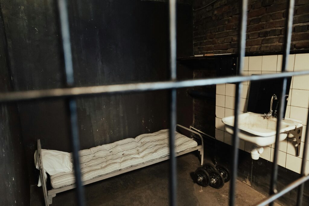 Bed, Sink and Dumbbells in Cell
