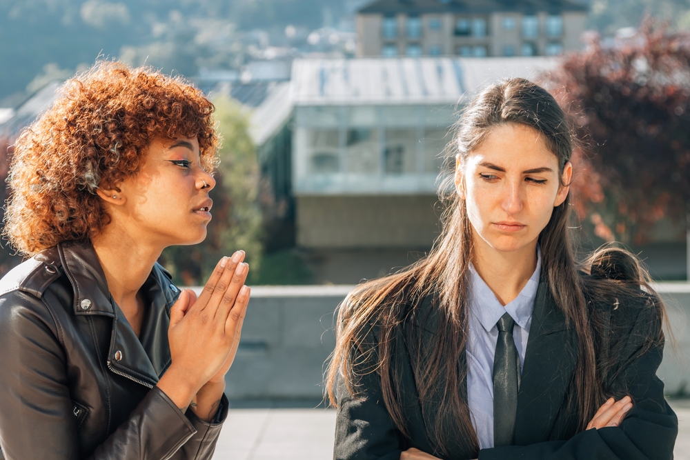 girl apologizing or sorry to her friend
