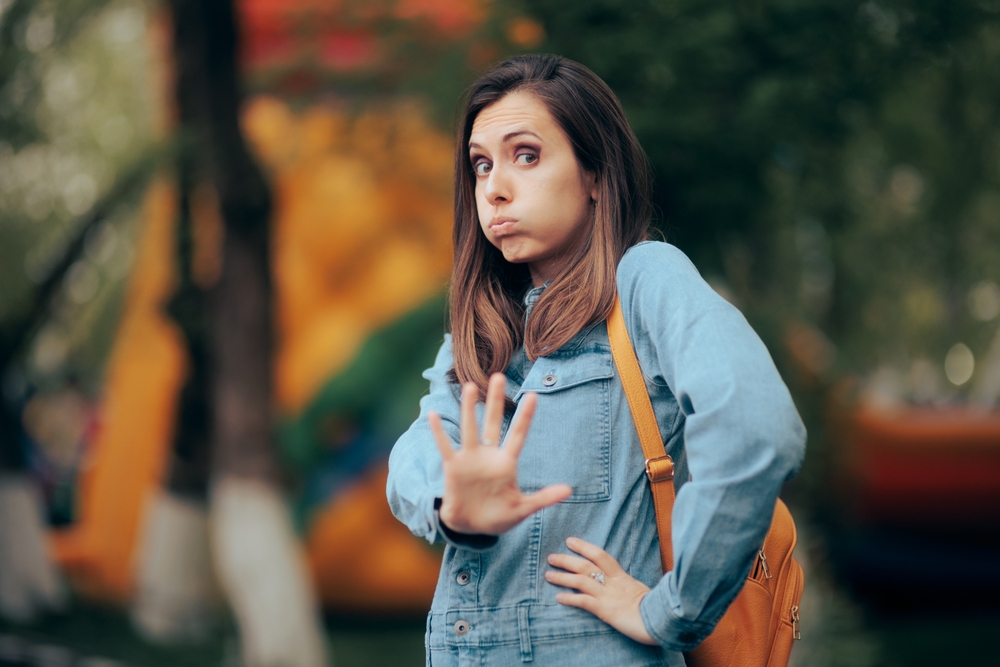 
Woman Saying No Asking for Personal Space and Alone Time. Girl setting boundaries for stalking ex-partner avoiding him
