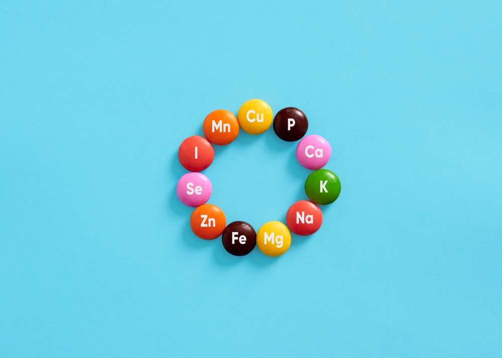 Nutritional mineral supplements. Health care. Minerals, body health and dieting. Essential Mineral symbols for body care on colorful pills.
