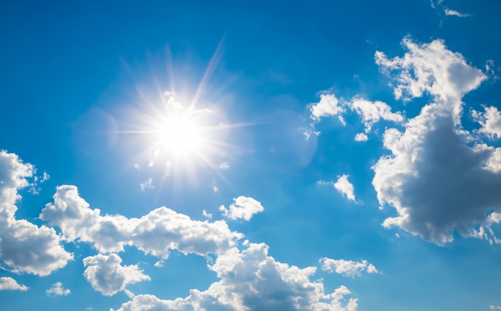 brightening the puffy clouds with the sun. sky perspective. gorgeous sky filled with sunlight. Clouds against a blue sky background. clouds against a clear sky.
