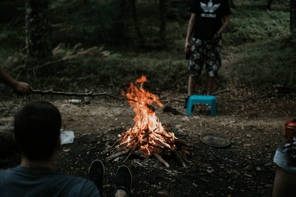 Man Sitting Near Bonfire