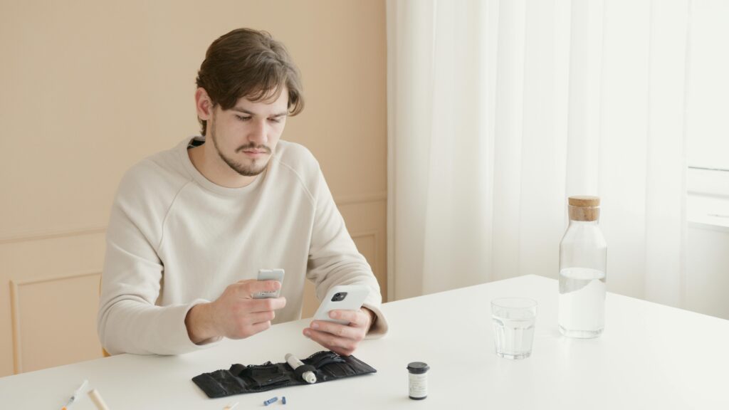 Man in White Crew Neck Long Sleeve Shirt Holding White Ceramic Mug