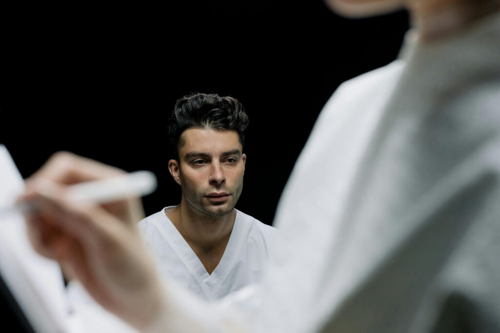 Person in White Scrub Suit
