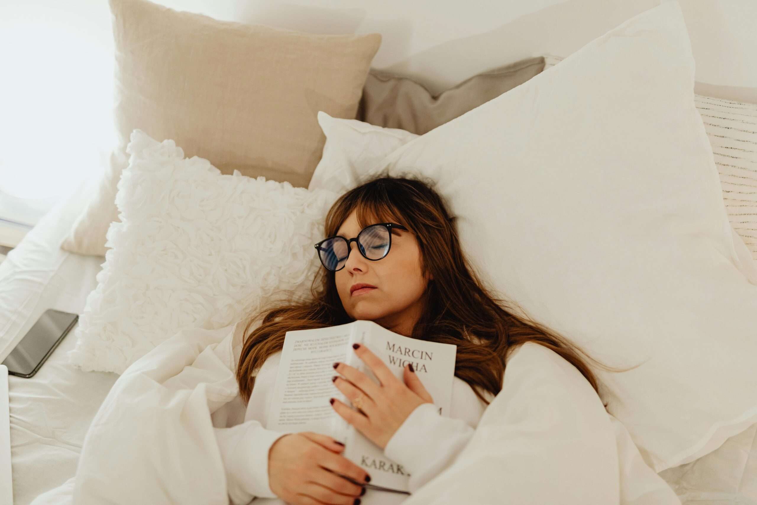 Woman Holding a Book Sleeping With Eyeglasses