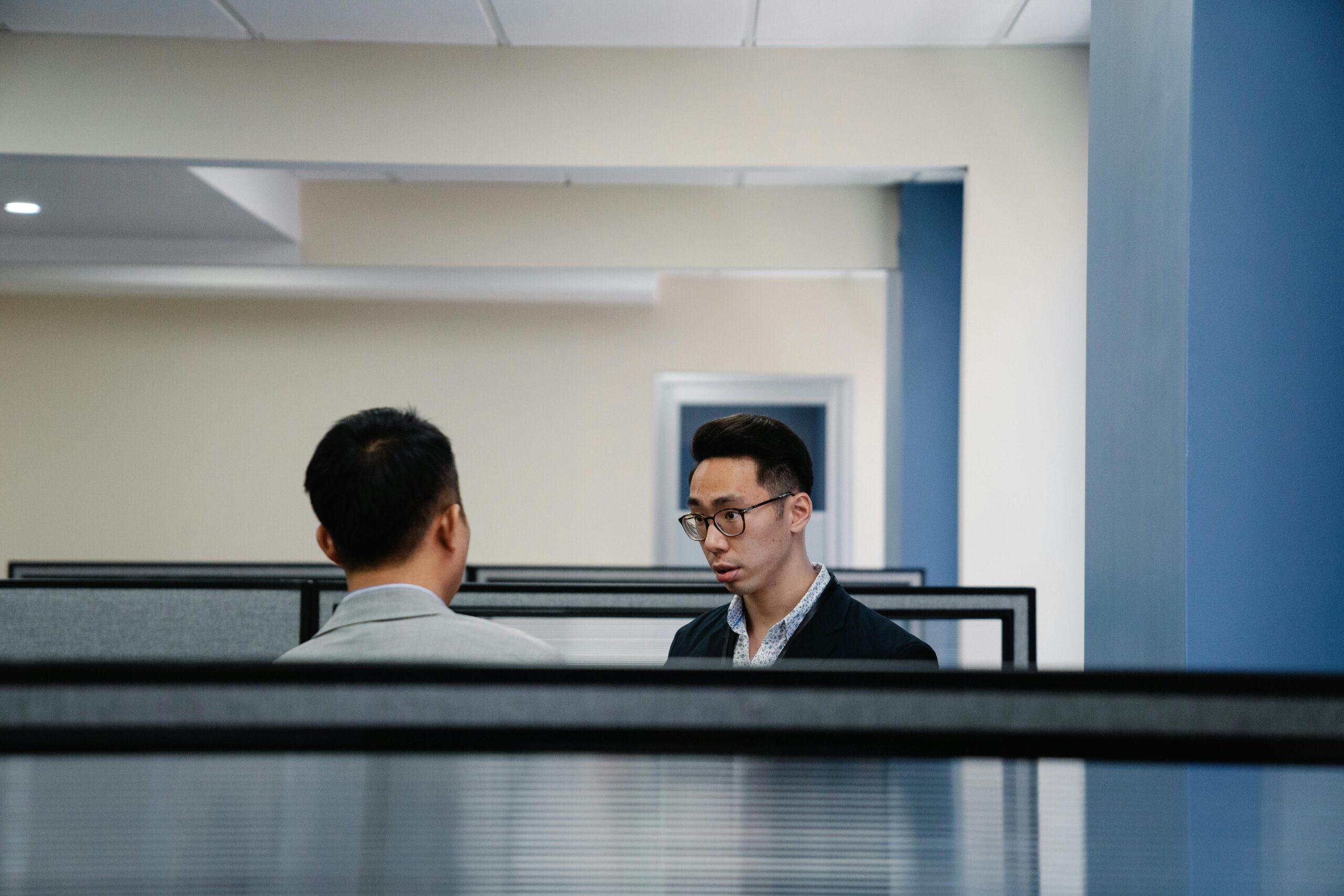 Men Talking Inside the Office