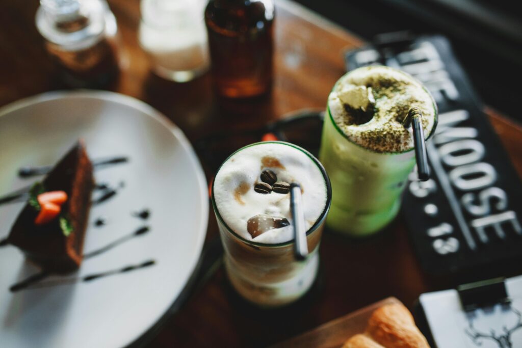 Tasty cold cappuccino and matcha latte served with chocolate pie