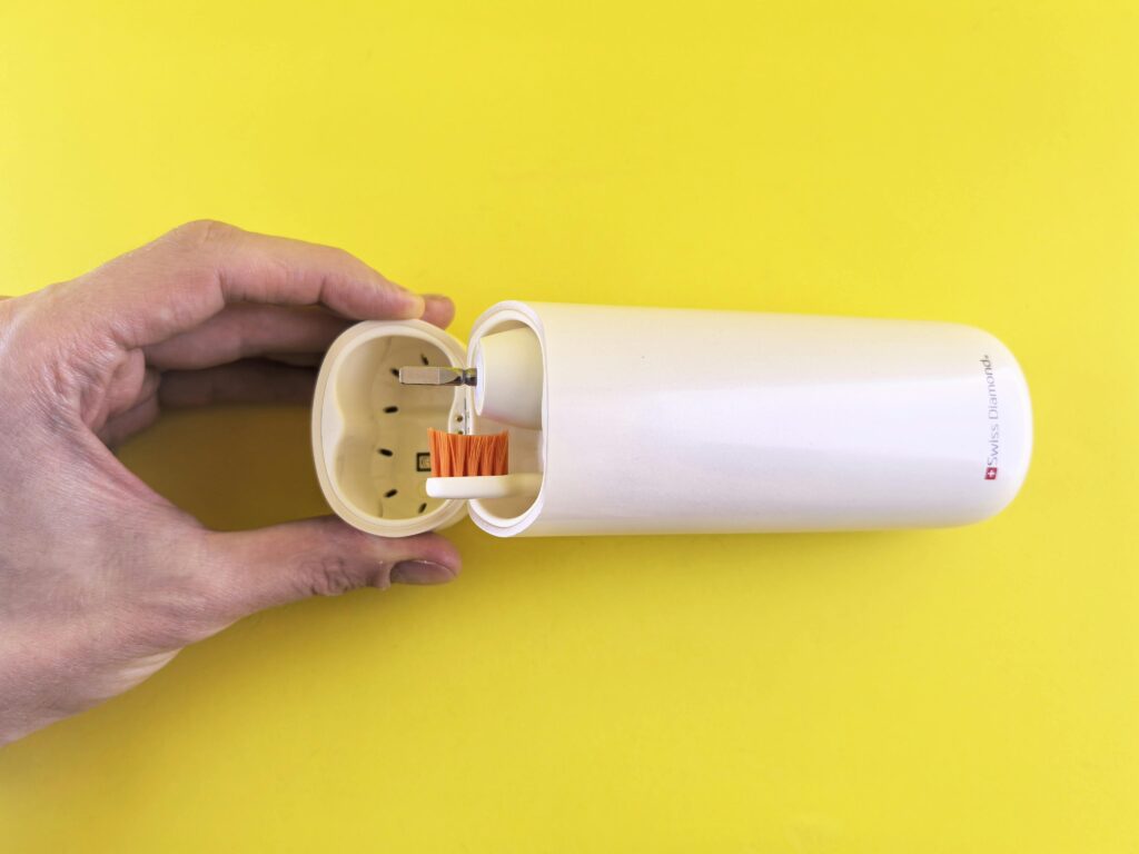 Portable Electric Toothbrush on Yellow Background
