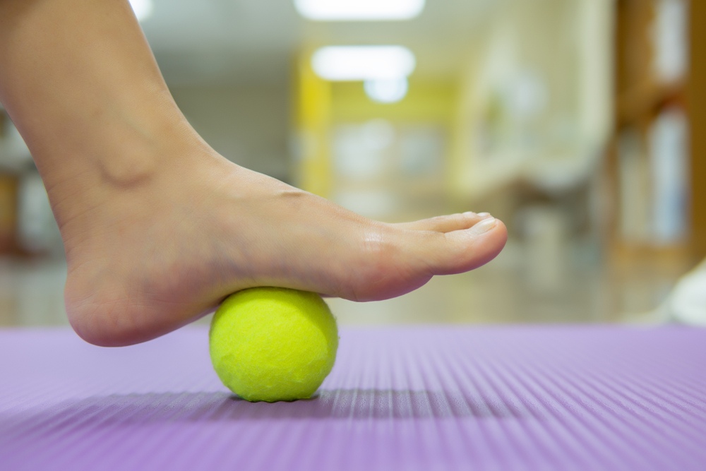 The Tennis Ball Treatment : The ball will apply pressure to the painful spot and raise the procedure. It’s effective, but you need to give it time to work. Image with copy space