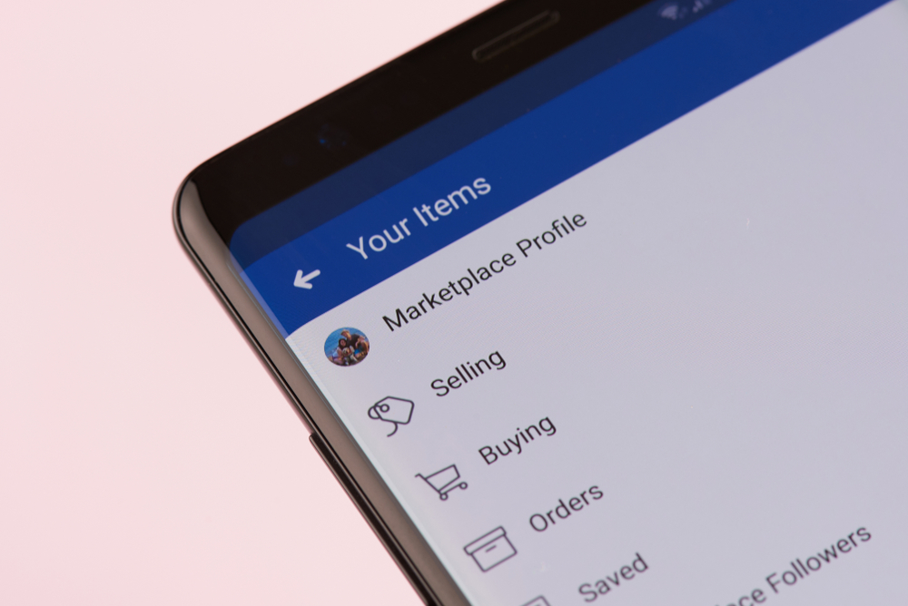 New york, USA - september 21, 2018: Facebook marketplace menu on smartphone screen background close up view