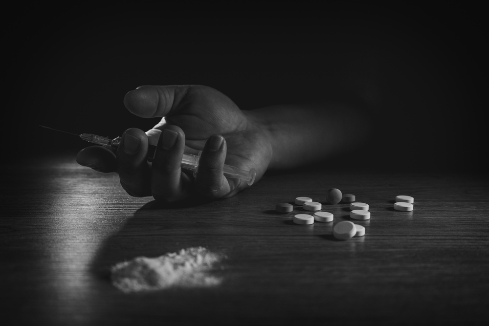 Stop drug addiction concept International Day against Drug syringe and cooked heroin on spoon