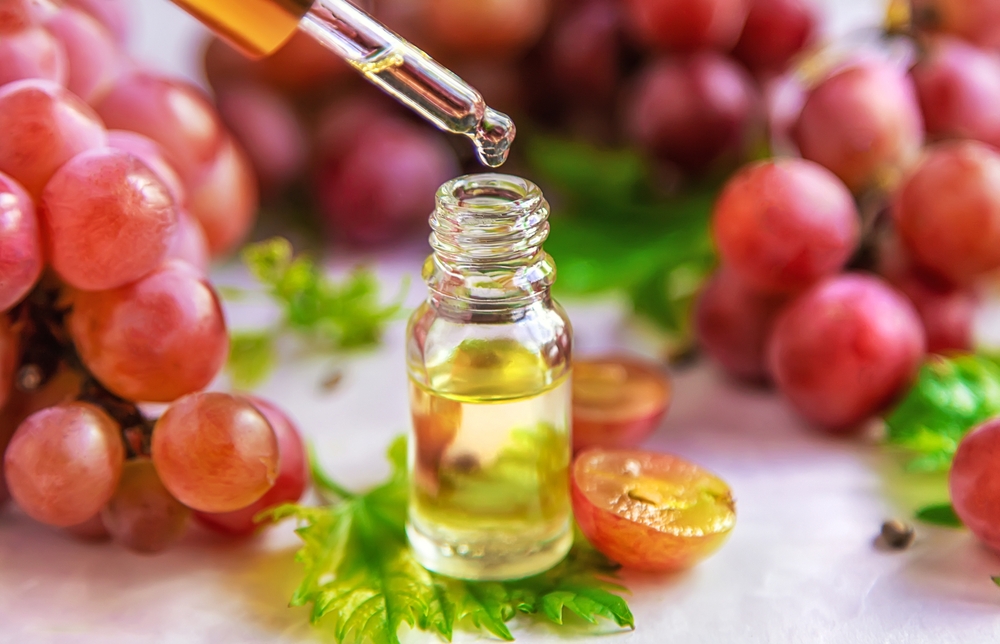 Grape seed oil in a bottle. Selective focus. Nature.