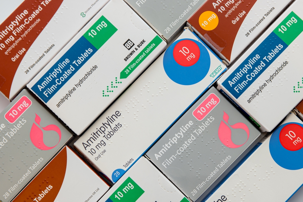 LONDON, UK – NOVEMBER 30, 2022: Boxes of various generic brands of 10mg Amitriptyline Hydrochloride tablets in diagonal flat-lay