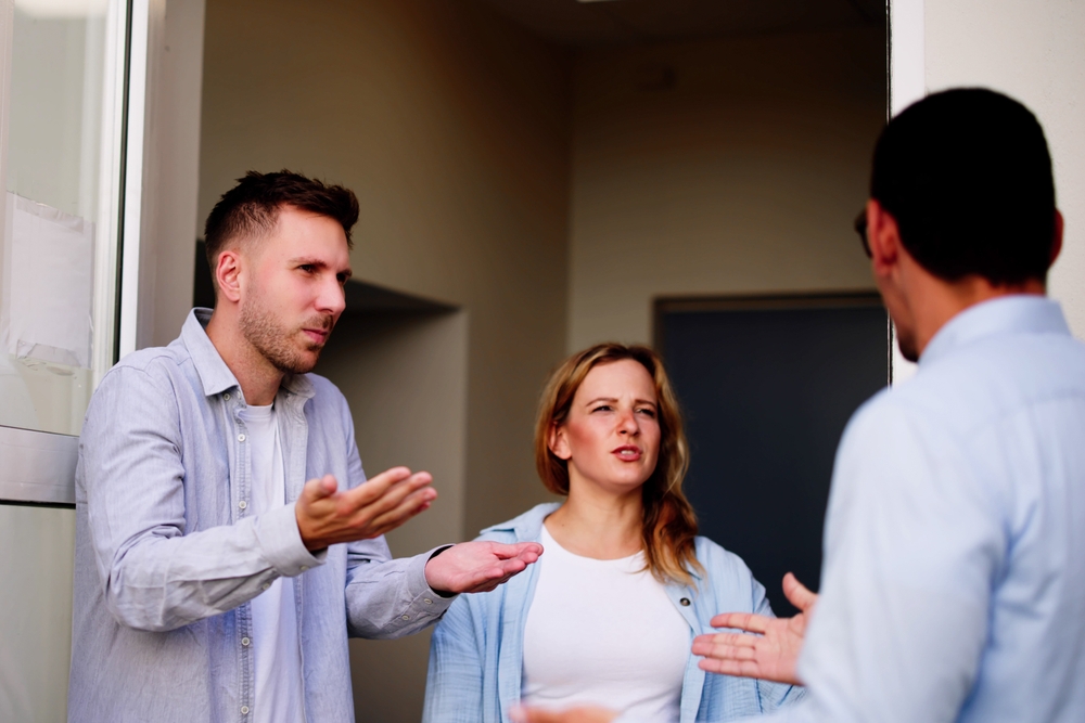 Angry dispute interrupts young woman's peaceful visit, revealing tension between neighbors quarreling over a living situation.