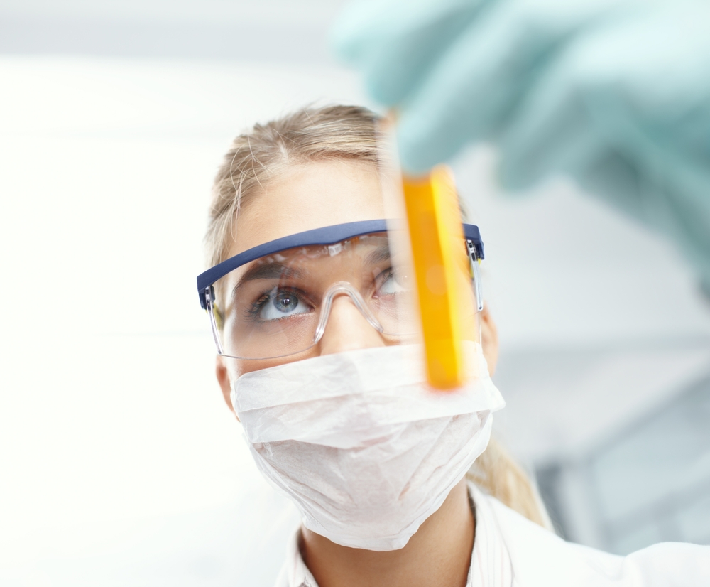 Woman, liquid vial and scientist for thinking in clinic, lab technician and urine test for drugs. Female person, biology research and monitor fluid for disease or infection, check protein and exam