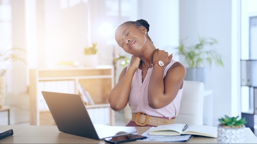 Business woman, neck pain and laptop with stress for human resources career, planning online and office research. African employee with fatigue, muscle pain and tired for deadline on her computer