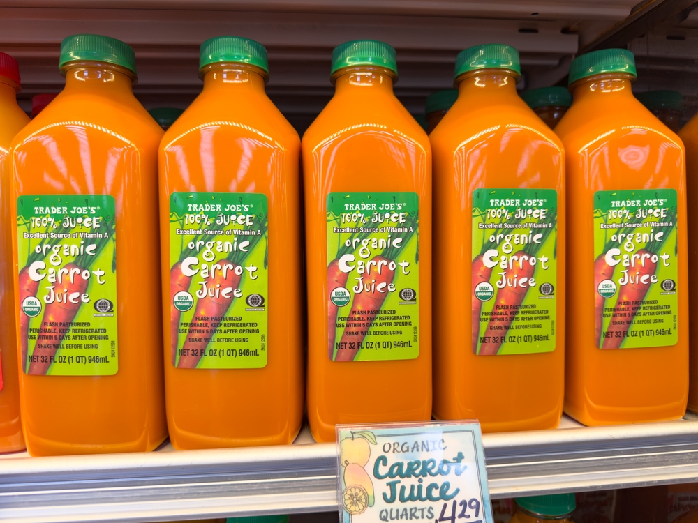 Los Angeles, California, United States - 01-01-2025: A view of several bottles of Trader Joe's organic carrot juice.