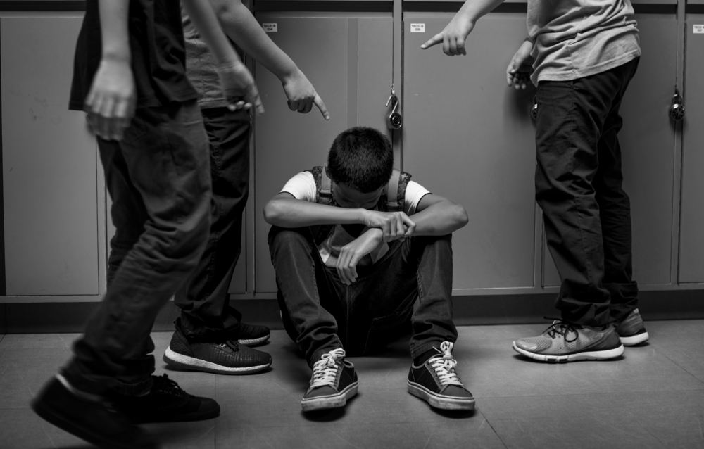 Boy student getting bullied in school