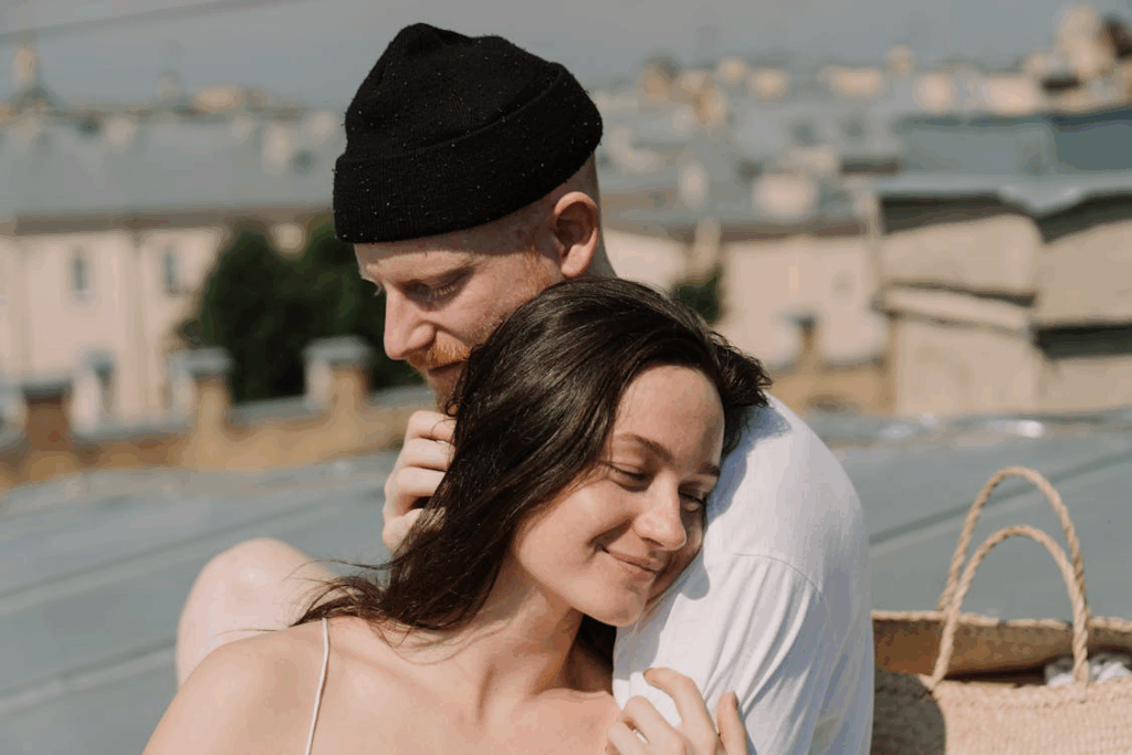 woman in white top with man in black hat