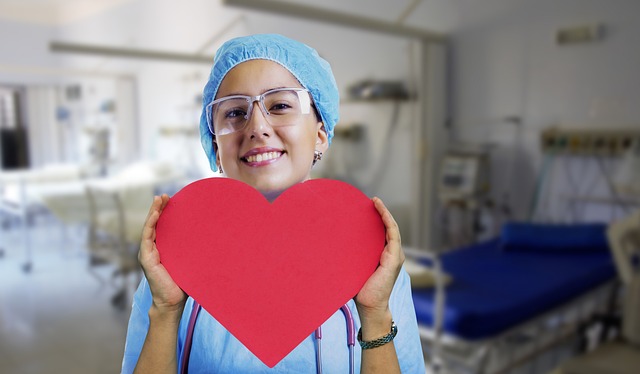 a doctor holding up a paper heart