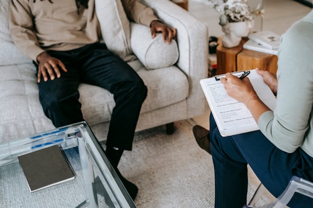 a man sits in a therapist's office