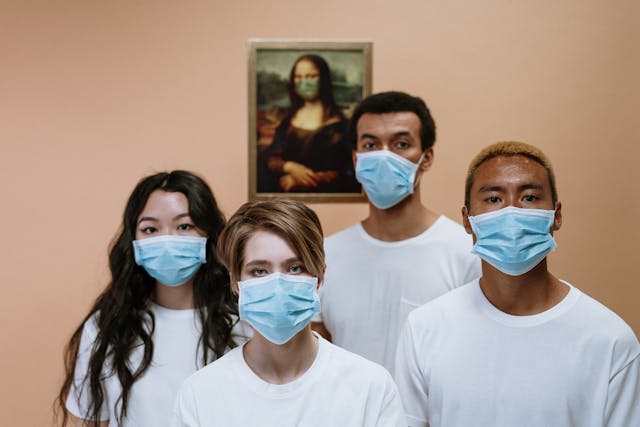 four students in masks