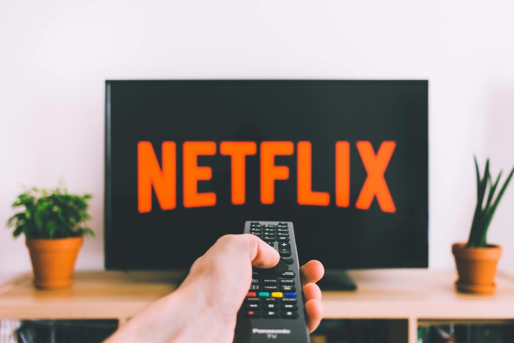 Person Holding a Remote Control
