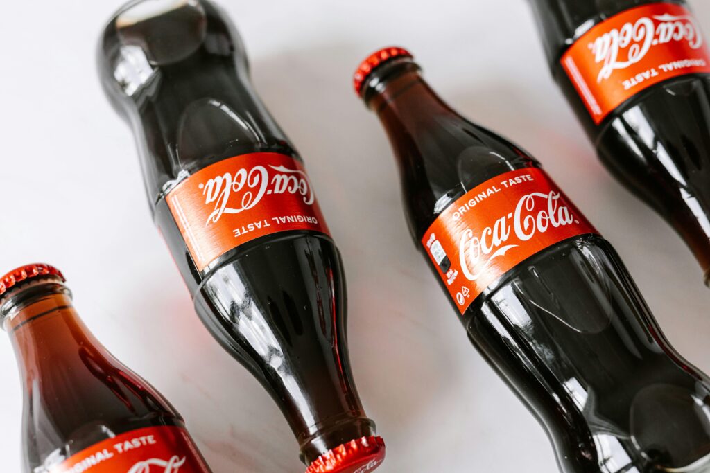 Bottles of soft coke drink on white background