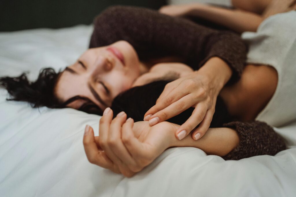 Photo of Two Women in Bed Together