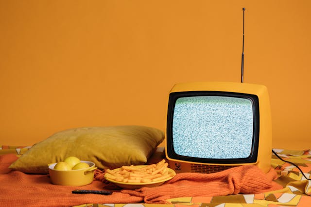 a retro television on a bed