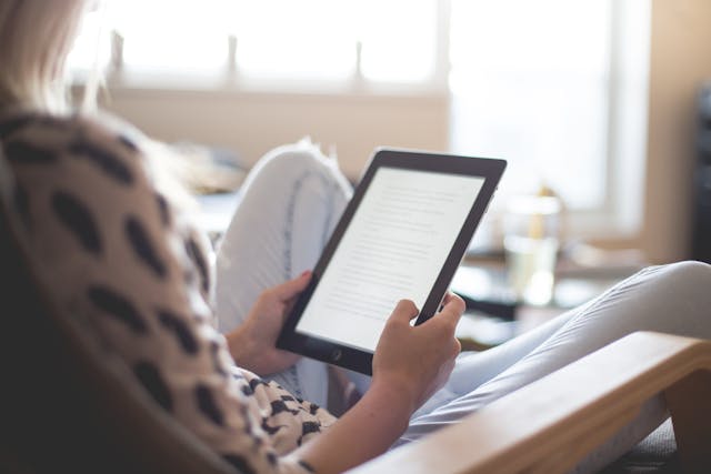 woman reading a kindle