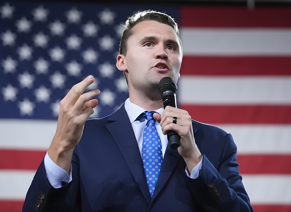 Charlie Kirk Speaking in Front of the USA Flag, American Politician