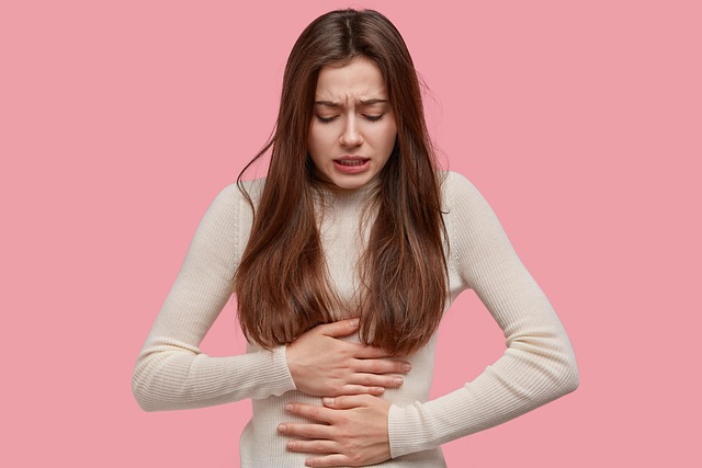 woman holding her stomach