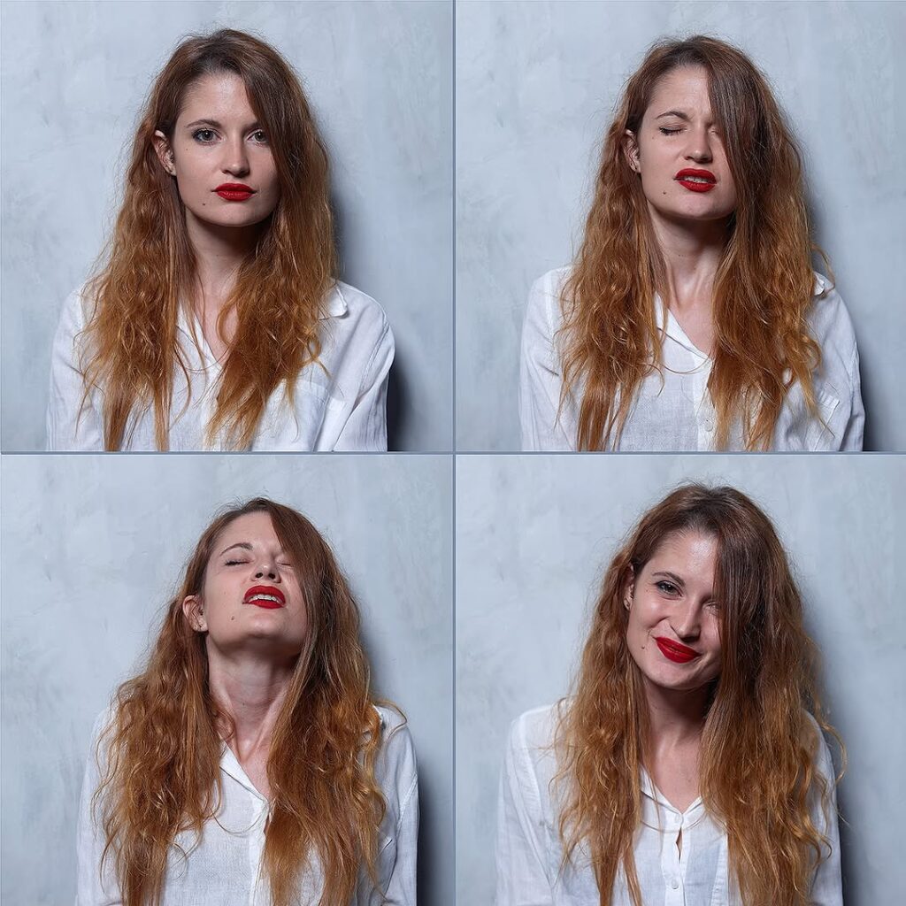 red-haired woman in white long sleeved shirt