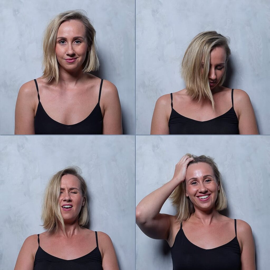 woman with hand on her head showing signs of happiness