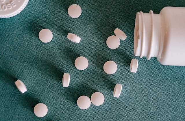 pills scattered on blue material