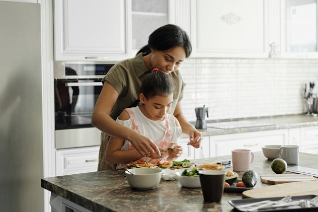 mother and daughterin kitchen