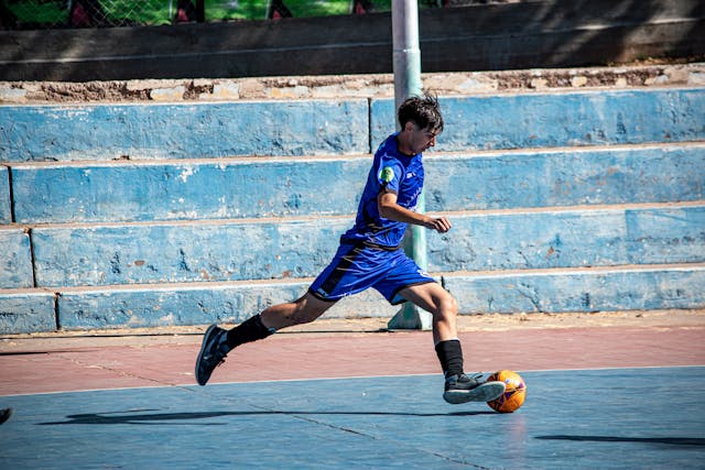 teen playing football
