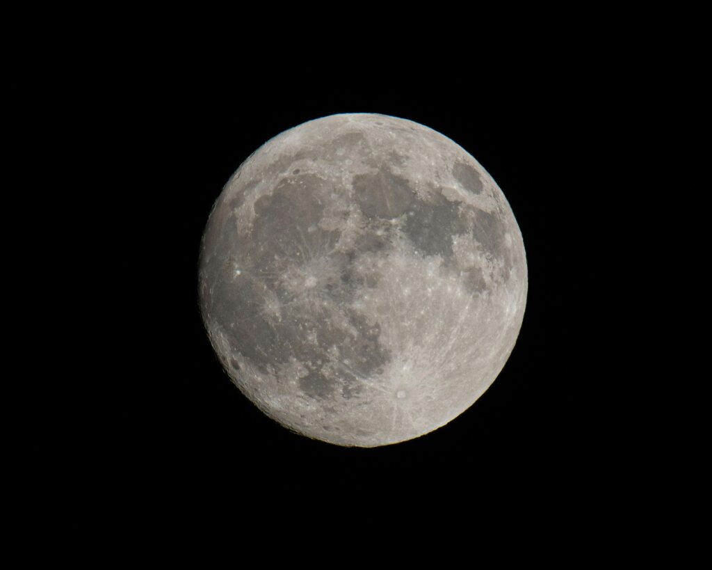 Detailed Full Moon Against Dark Sky

