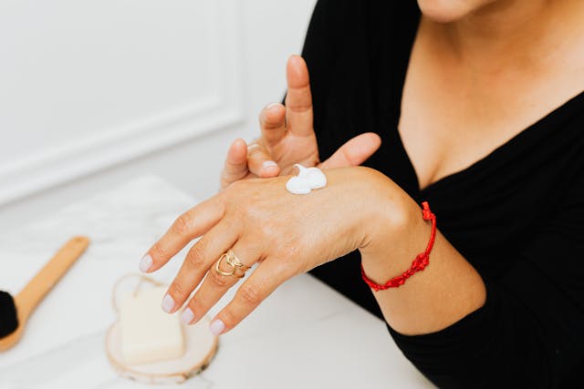 woman applying cream