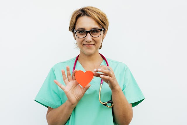 doctor holding a paper heart