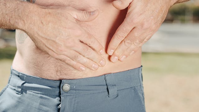 man holding stomach