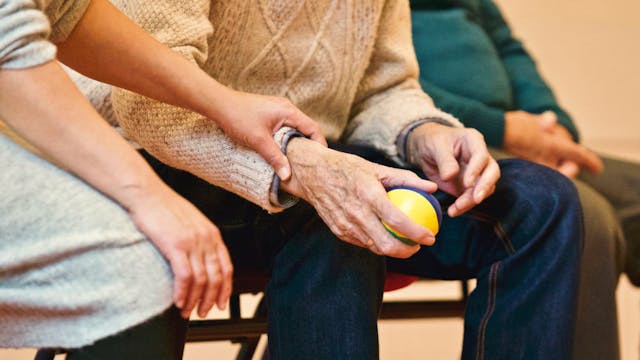 nurse supporting Alzheimer's patient