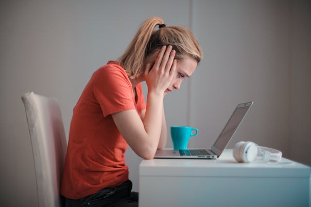 concerned mother using laptop