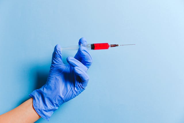 doctor holding a vaccine