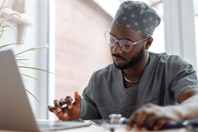 doctor working on a laptop