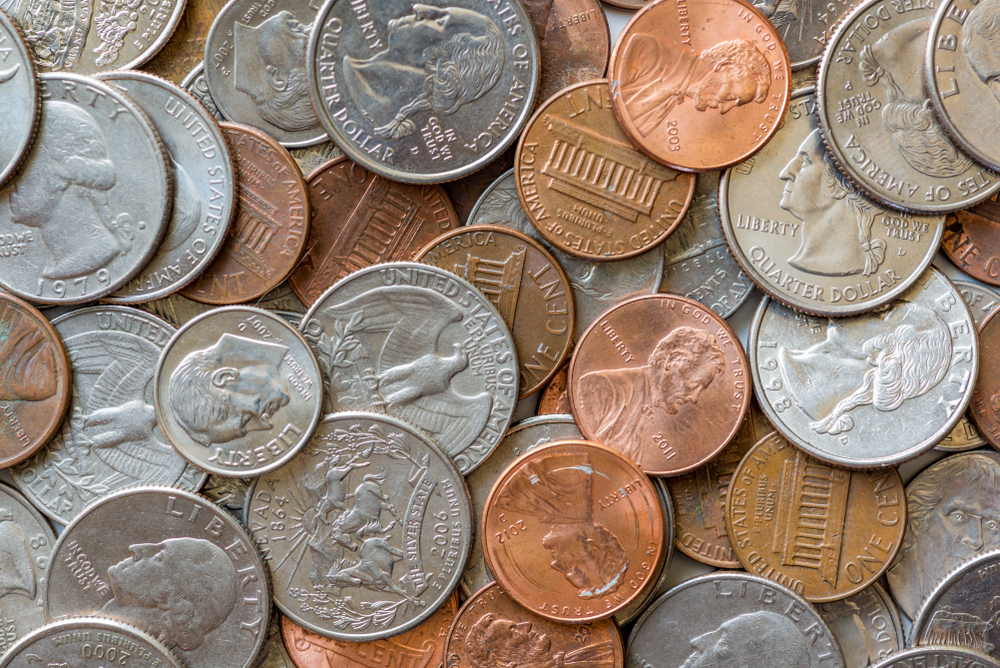Close-up of a one cent, 10 cent and a quarter coins
US Coins