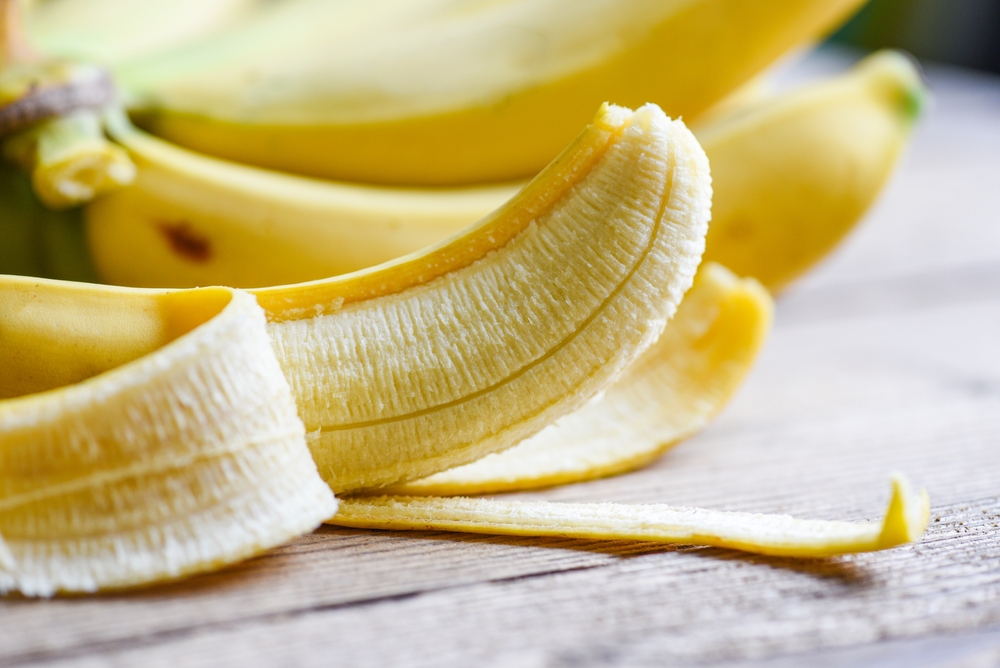 banana peel on wooden background, Close up ripe banana peel on floor