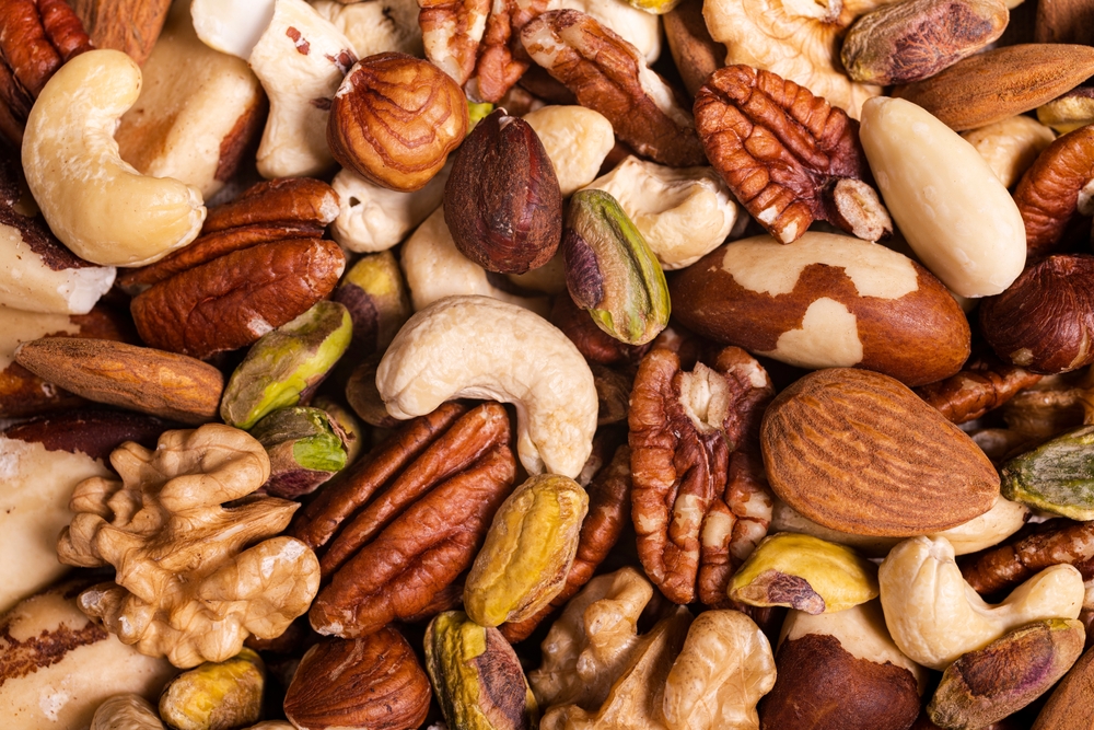 extreme close-up top view, a background with a large variety of shelled nuts.